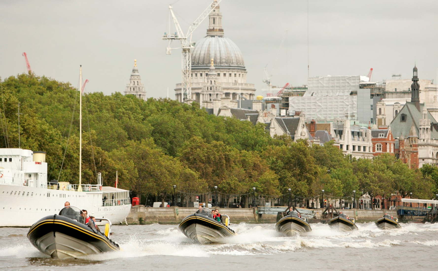 Corporate guests aboard high-speed RIBs on the River Thames with St Paul’s Cathedral and the London skyline in the background